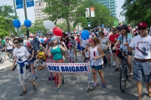 The “Bike Brigade” joins the 26th annual 4th on 53rd Parade as it kicks off on South Lake Park Avenue, Tuesday, July 4, 2017.