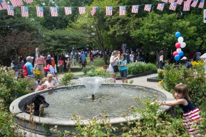 The fountain in Nichols Park serve as a cooling station after the 26th annual 4th on 53rd Parade, Tuesday, July 4, 2017.